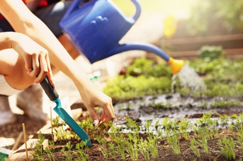 Gardener preparing tools on a work van before starting job
