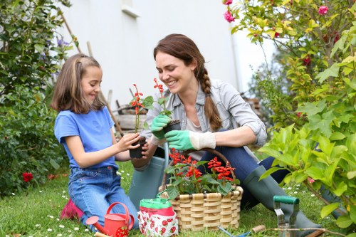 Team leader reviewing gardening work with client